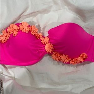 Hot pink bathing suit top with orange details